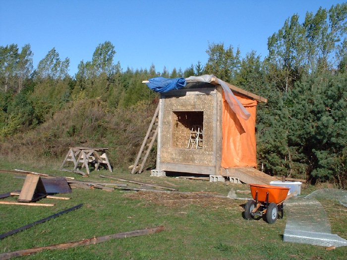 The straw bale walls have been layed and stiched.