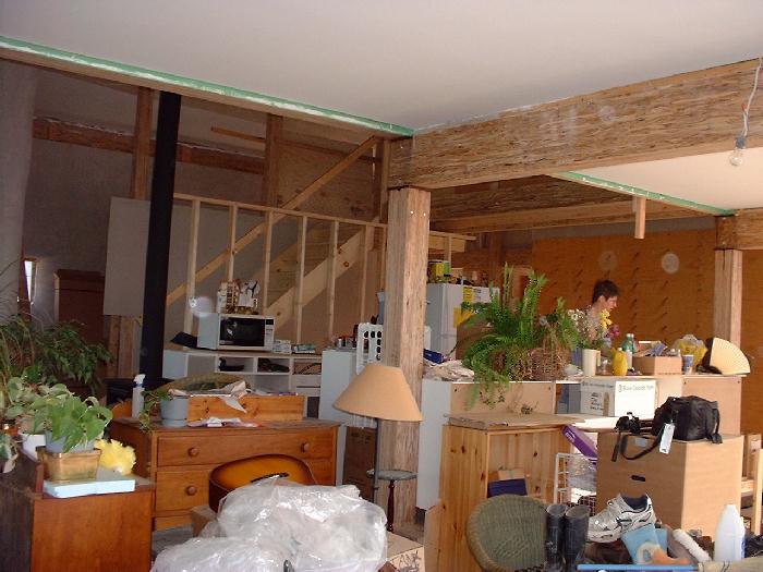 Leigh prepares breakfast in our kitchen which has been partially constructed. The kitchen cabinets are Ikea. They do not use formeldihyde. The final cabinetry will be birch. For now the kitchen and li