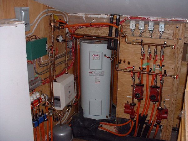 The utility room for the entire homes heating system is located on the 2nd floor north of the bathroom. This picture shows the entire mechanical room.