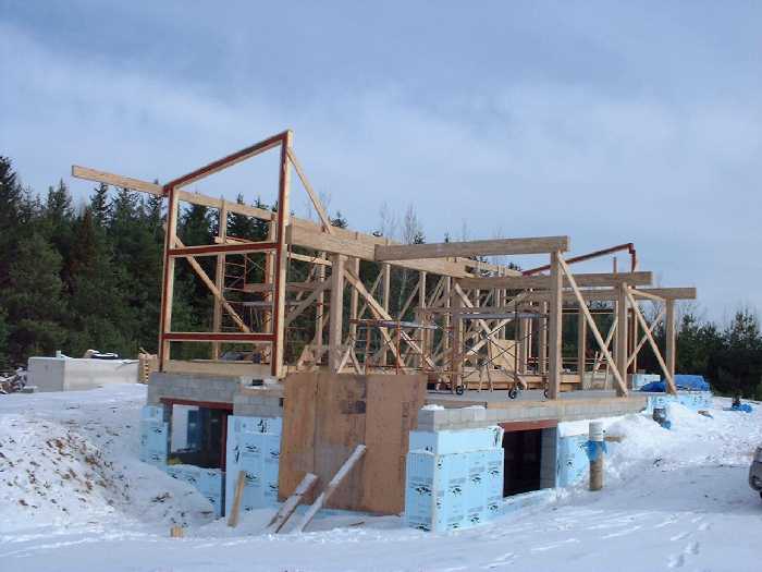 Looking at the newly framed ground floor from the south west looking north east. The beams are mainly Glulam constructed beams made from fast growing trees.
