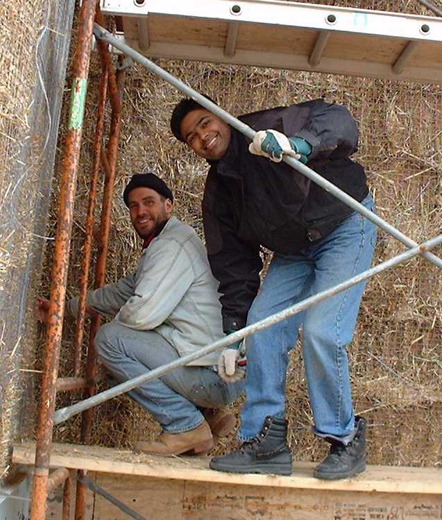 Sewing the bales together. These guys are enjoying the work.