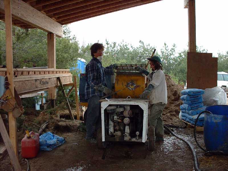 Richard and Tina prepare the plaster in a mixer and pump combination..