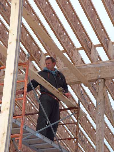 Left - Colin works on the high scaffolding. Right- Richard secures the structure.