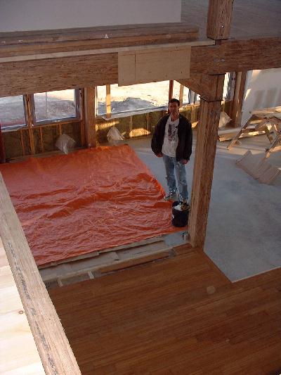 John paints the ceiling on the ground floor. The newly install banboo floor is ready for the kitchen to be assembled and installed..