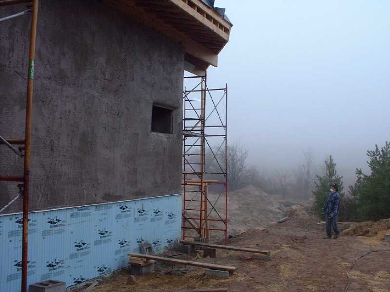 Richard sets up scaffolding to do the second coat on the outside walls.