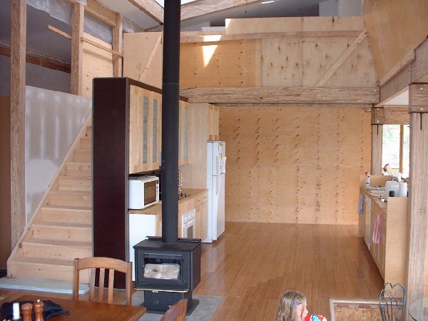 The kitchen is central to the house. The wood burning stove is also centrally located in order to provide extra heat during the coldest days of winter.