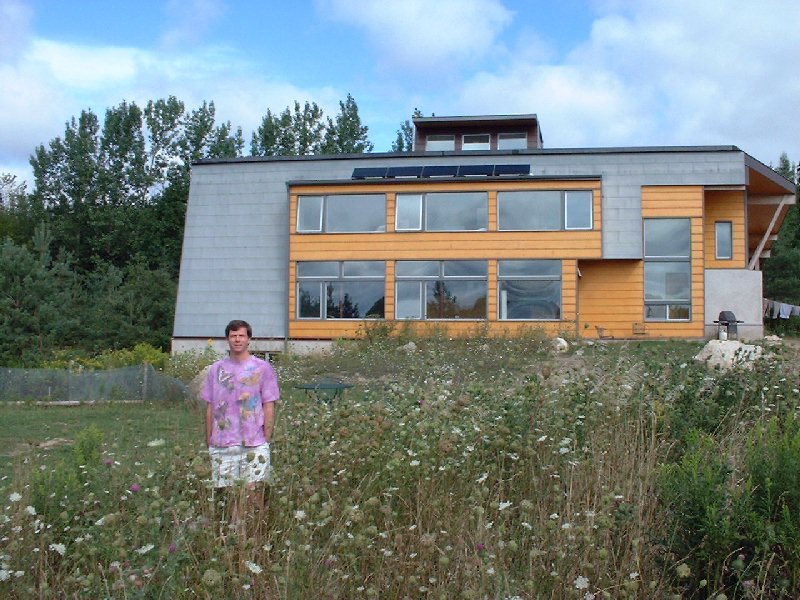 Wind and solar power system combine with passive solar to create a comfortable home all year.