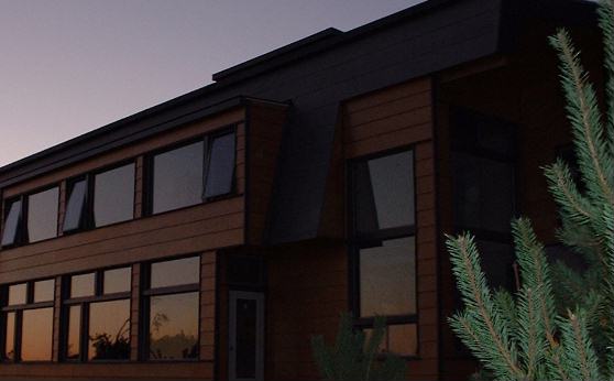The clear fall day leaves a lasting impression on the windows of the south side of the house.