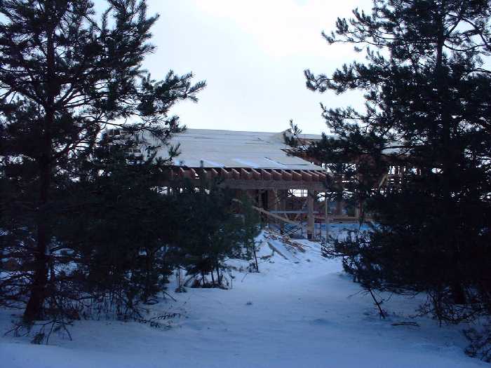 February 10 , 2001 - The roof now includes the car port. Just imagine some grass growing on it.
