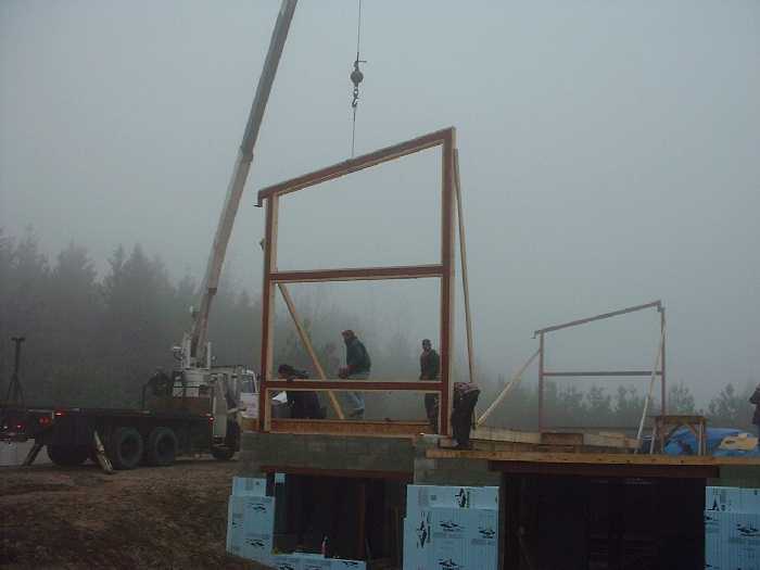 November 13 , 2000 - Looking east as the west frame is positioned. The east frame is in position and ready for post and beam construction.