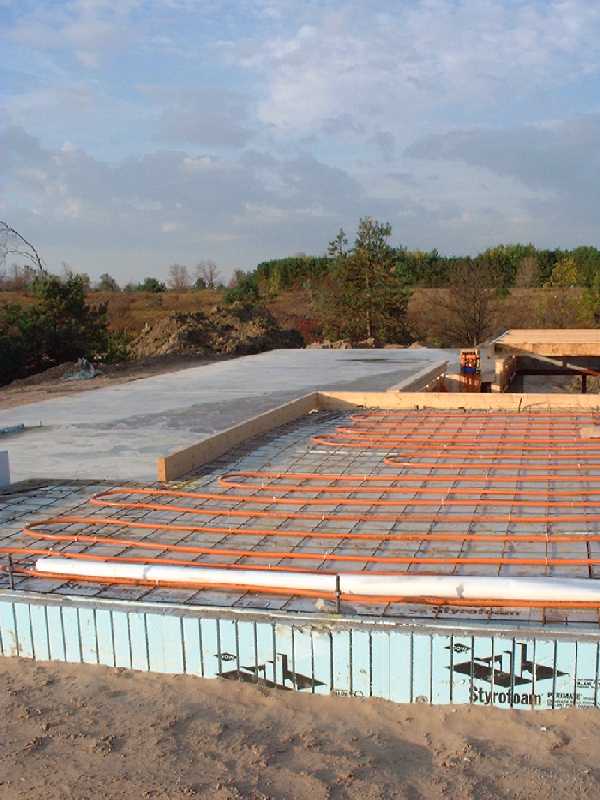 The ground floor heating tubing comes together at a distribution point.