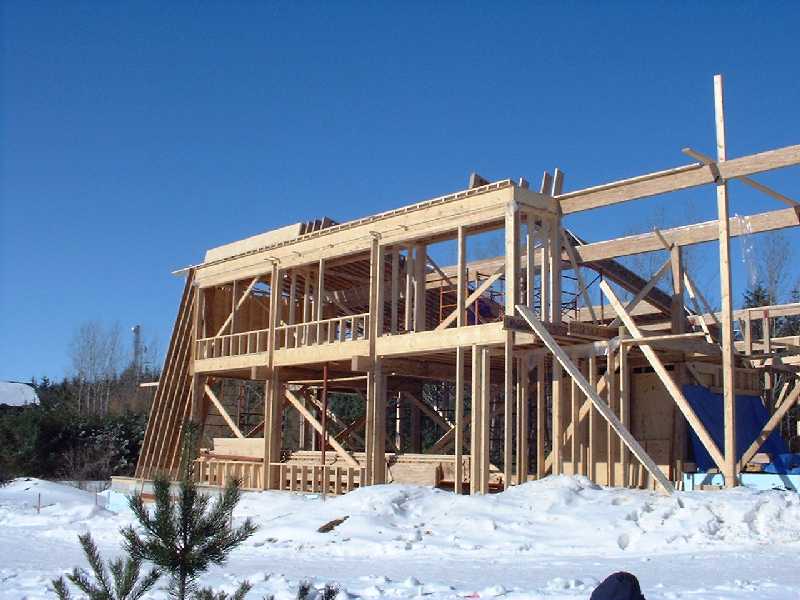 The south face of the house clearly shows the many windows which will allow sun light to heat the interior concrete floors and warm the house on these cold (-10C) days.
