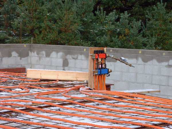 The ground floor heating tubing comes together at a distribution point.