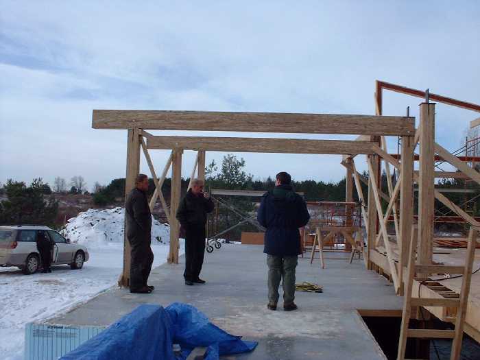 Reviewing the construction. From left to right, Colin, Hal and John.