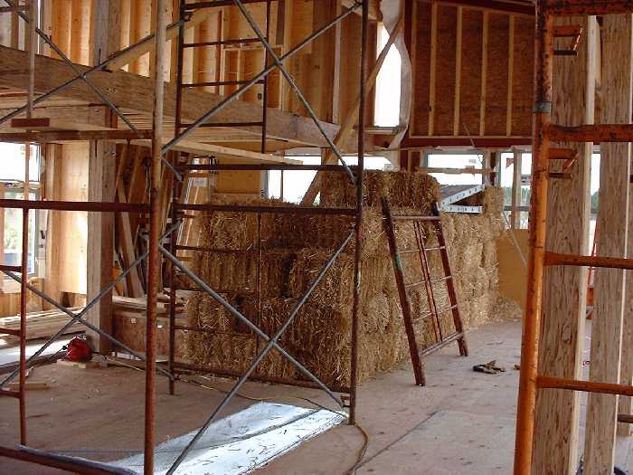 The remainder of of the straw bales stand ready near the kitchen area.