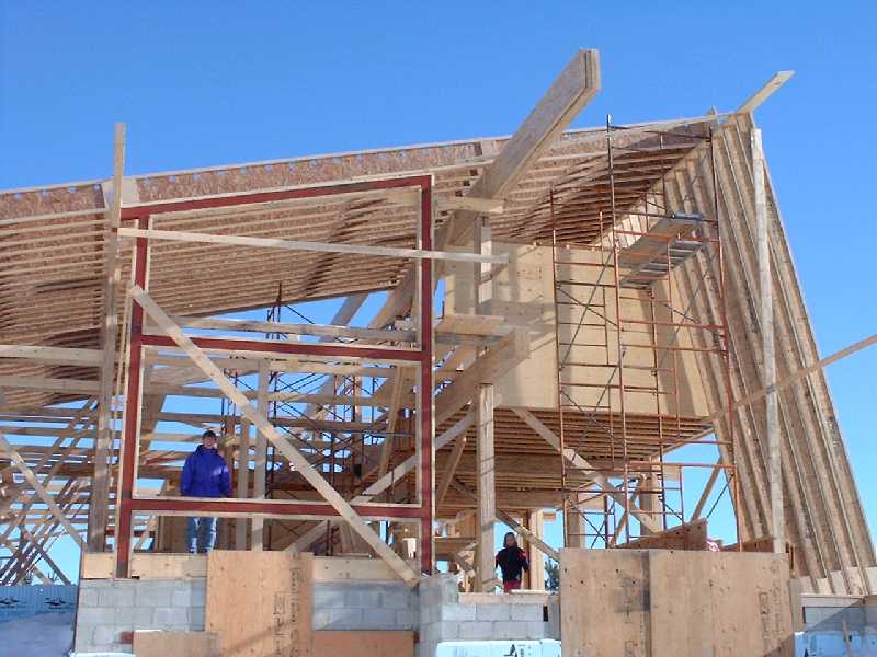 The simple post and beam design, tuned perfectly to the angles of the sun, mimics natures best designs. Leigh and Claire look out to the west of the house through the entirely framed walls.