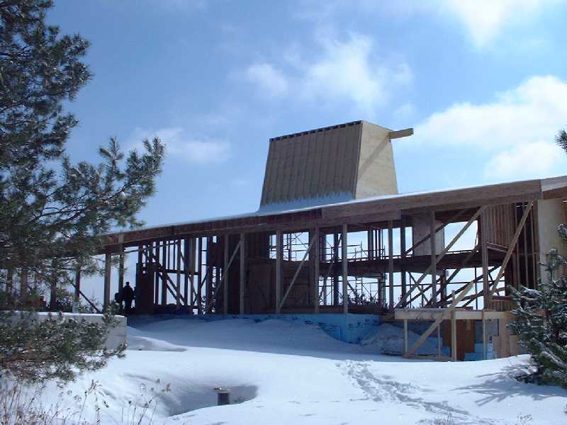 Looking south east through the house. The new sky light on the roof provides light and ventilation and air conditioning.