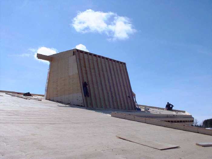 The "dog house", the large sky light, provides extensive lighting and ventilation into the center of the house where the kitchen is located. This system will provide a non mechanical cooling system an
