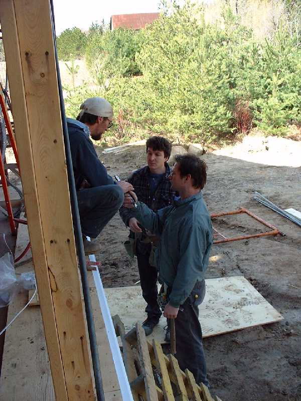 Bernie, Pete and Chris exchange ideas on the best ways to use tools.