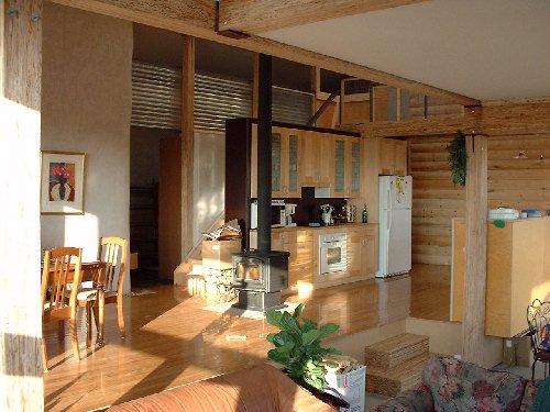 The kichen, stairs, bridge and cupboards are finished. Only minor doweling remains for the railing. Light from later afternoon sun warms the centre core of the house on this sunny cold day.