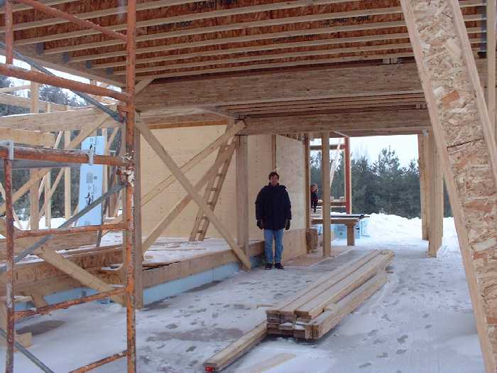 The living room and green house space. The beam on the far right is the angled wall in the main living room area.