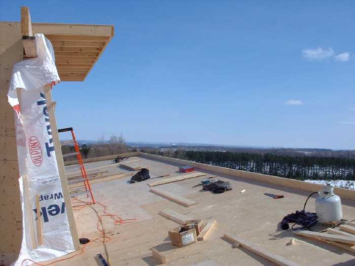 Looking east on the roof. Solar hot water heaters will sit on each side of the sky light.